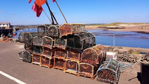 Fisherman's lobster pots on Ambled harbour waiting to be loaded