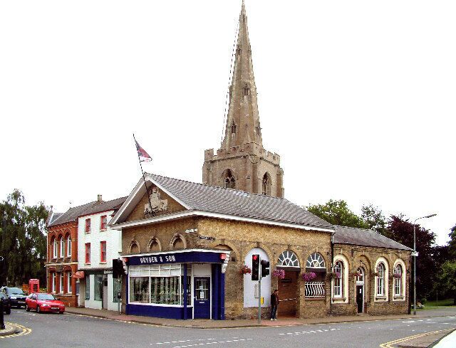 Holbeach Town Crossroads. The view of Drydens Jewellers with the church behind. The building in the foreground was formerly the fire station