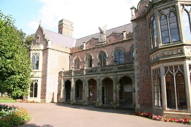 A historic building with arched windows and a brick facade.