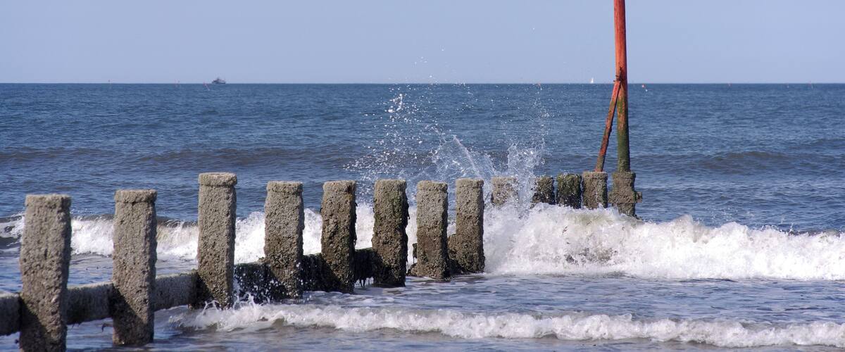 Waves break on a groyne at Redcar.