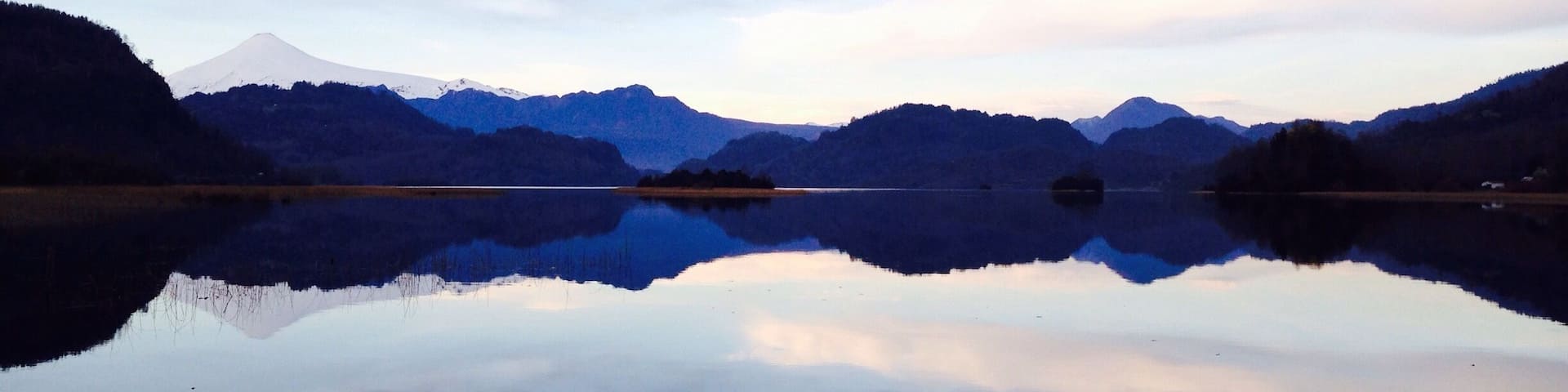 A lakeside view to the #volcano Villarica close to the small town Panguipulli