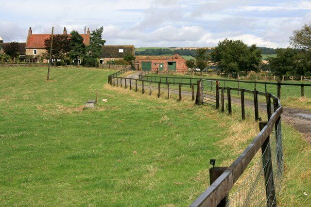 Snow Hall Farm A Public Footpath continues along the farm road.