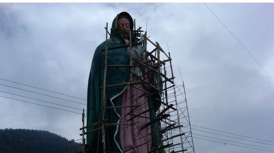 Large statue of the Virgin de Guadalupe, shown here under construction. Incredible view of Xicotepec and the surrounding mountains.