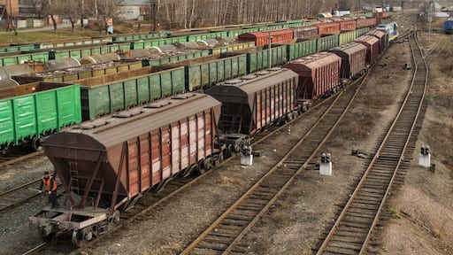Freight wagons on railway station. Cargo terminal. Industrial background