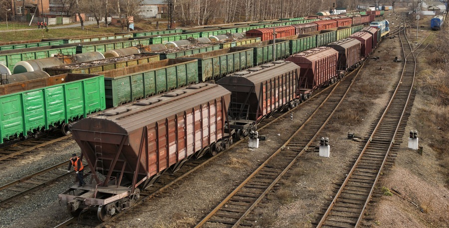 Freight wagons on railway station. Cargo terminal. Industrial background