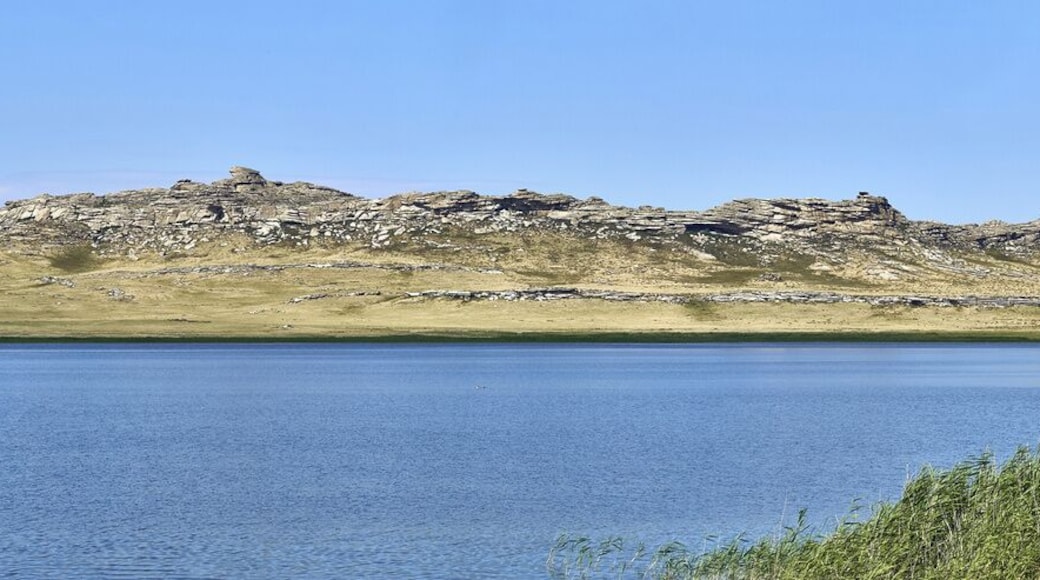 Beautiful summer steppe landscape and Ayr (Monastyri) Lake, located in stone mountains "Monasteries" and "Aiyrtau" (1003 meters above sea level), near the town of Ust-Kamenogorsk in East Kazakhstan