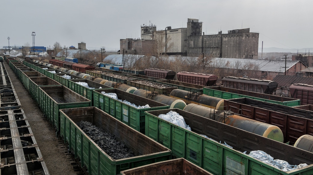 Freight wagons on railway station. Industrial background