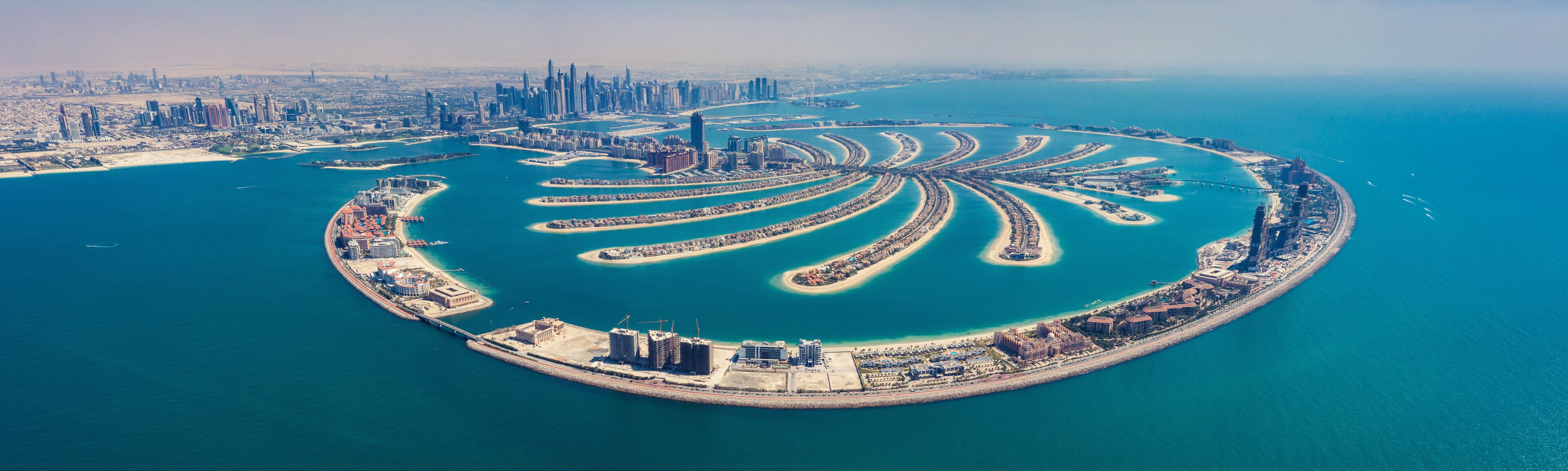 Aerial view on Palm Jumeira island in Dubai, UAE, on a summer day.