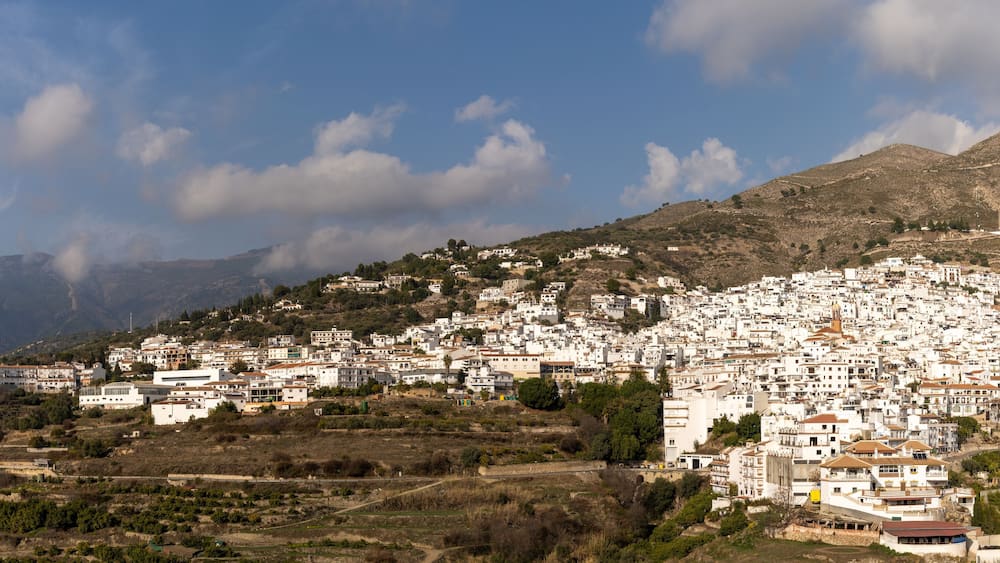 panorama view of a whitewashed village in the hills above Malaga in the Andalusian backcountry