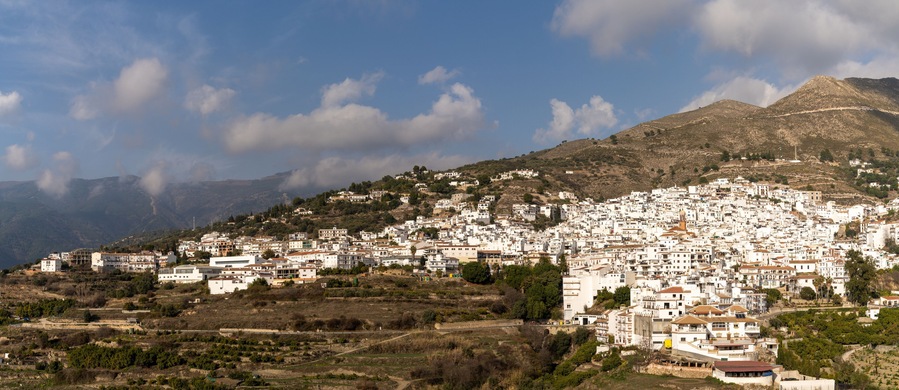 panorama view of a whitewashed village in the hills above Malaga in the Andalusian backcountry