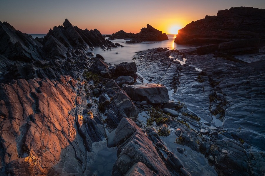 Sun down and tide out at Hartland Quay