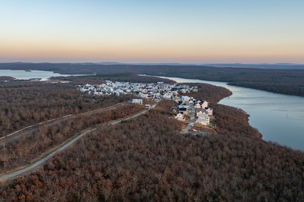 Panoramic view of lakeside houses and homes in Carlton Landing, Oklahoma resort town on Eufaula Lake during sunset with surrounding landscape