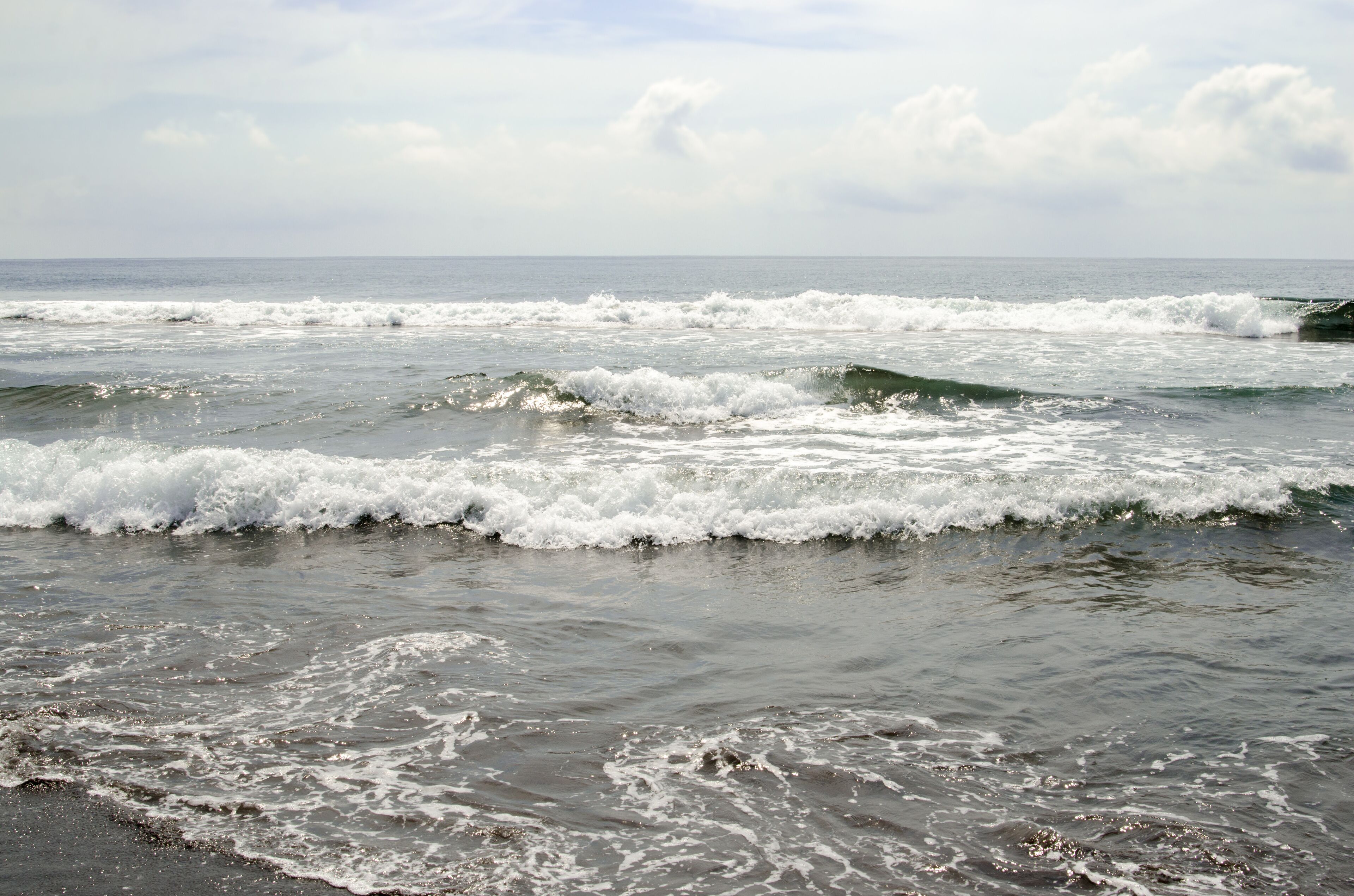 Waves break on Playa Cuyutlan, a black sand beach near Manzanillo  in Colima, Mexico.