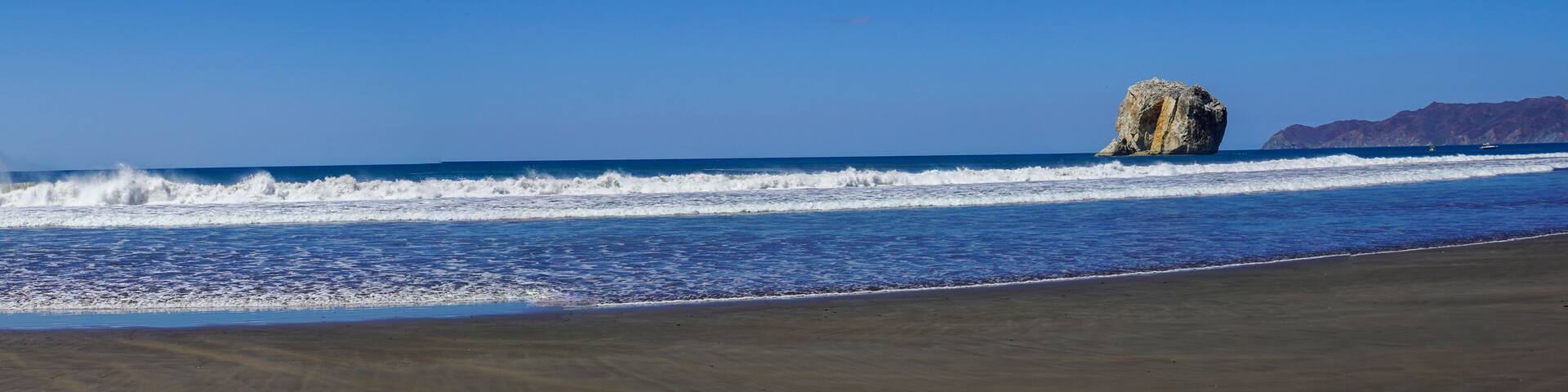 Beautiful aerial view of a sunset in Naranjo Beach - Witch Rock Costa Rica