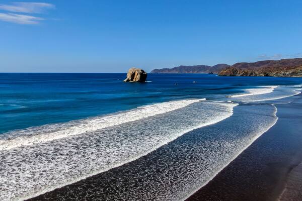 Beautiful aerial view of a sunset in Naranjo Beach - Witch Rock Costa Rica