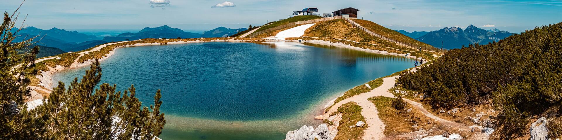 High resolution stitched panorama of a beautiful alpine summer view with reflections in a pond at the famous Steinplatte summit, Waidring, Tyrol, Austria