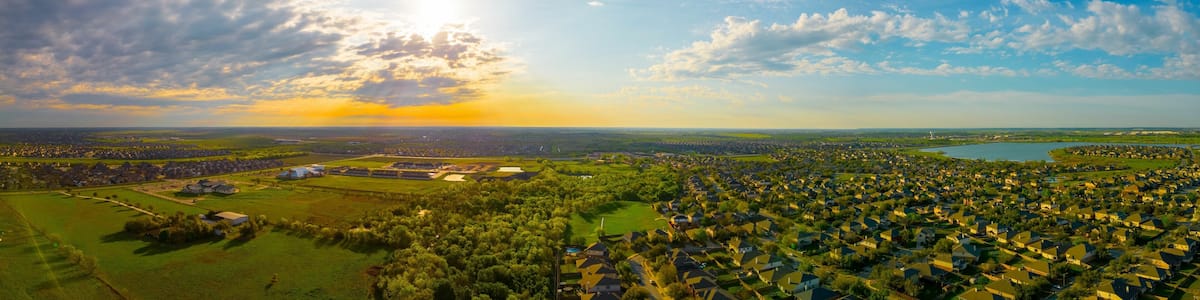 Stunningly beautiful sunrise illuminates Lake Pflugerville in the Villages of Hidden Lake