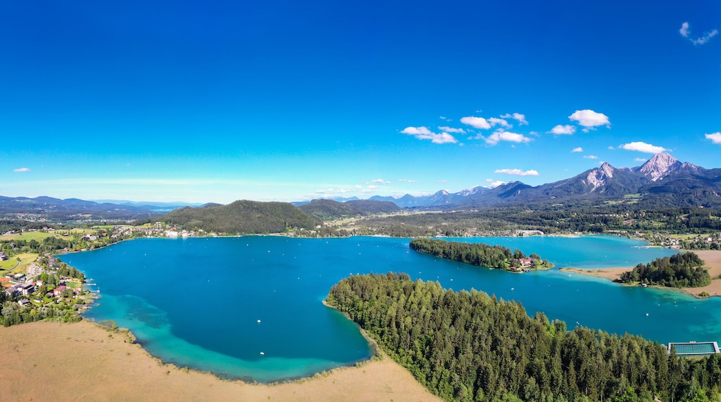 Faaker See in Carinthia. Aerial view to the beautiful lake and the Mittagskogel mountain in the south of Austria.