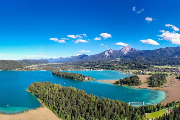 Faaker See in Carinthia. Aerial view to the beautiful lake and the Mittagskogel mountain in the south of Austria.