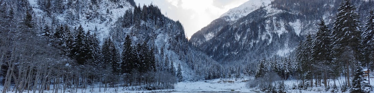 ötzlsee in valley großarl in austria in winter, partly frozen on sunny day