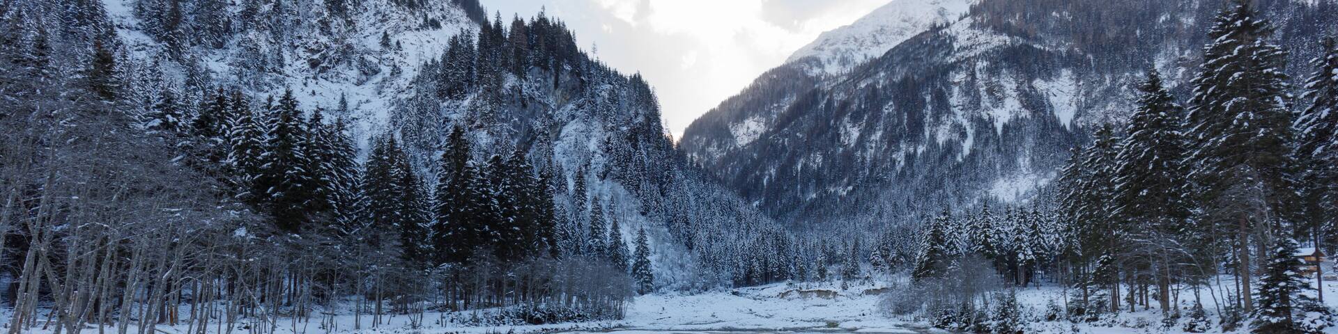 ötzlsee in valley großarl in austria in winter, partly frozen on sunny day