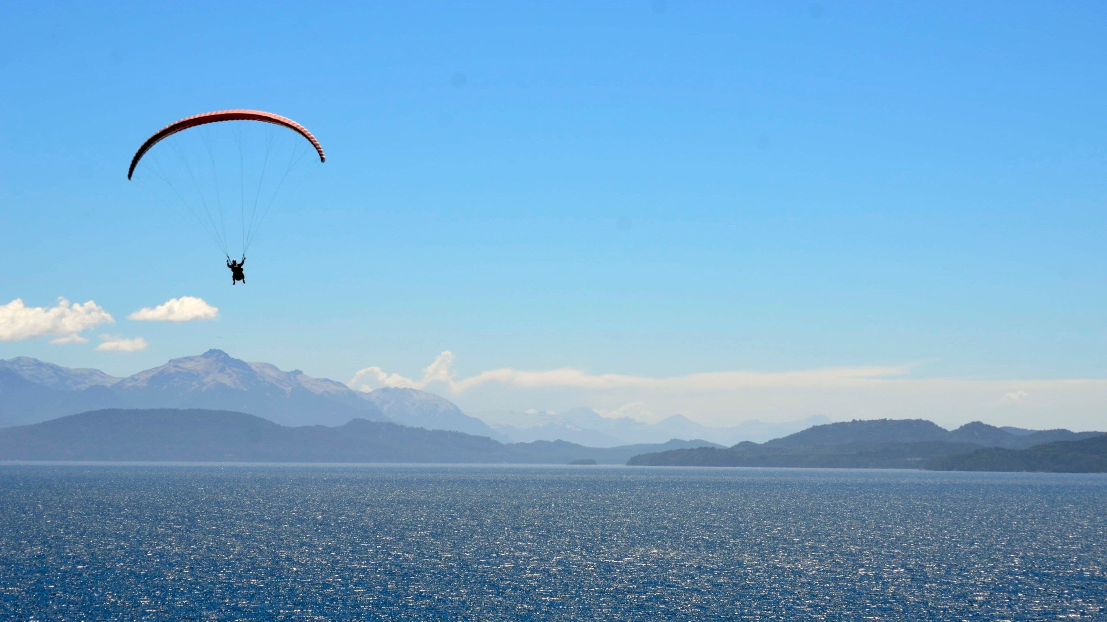 Bariloche showing a lake or waterhole and parasailing