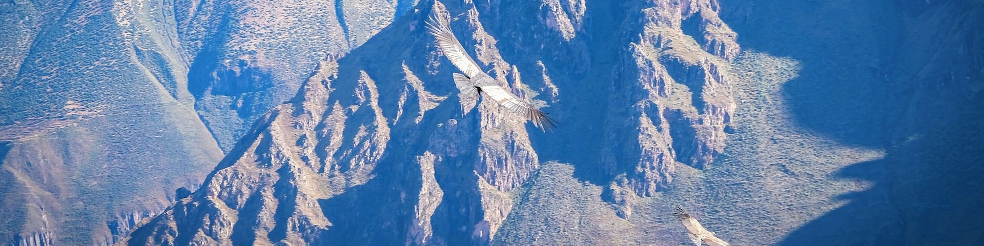 A rugged mountain range with sharp peaks and deep valleys.