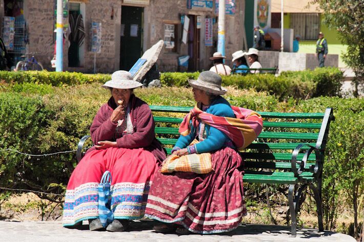 Ladies up in the Andes mountains of Peru enjoy a much deserved ice-cream break... probably while sharing some gossip!
