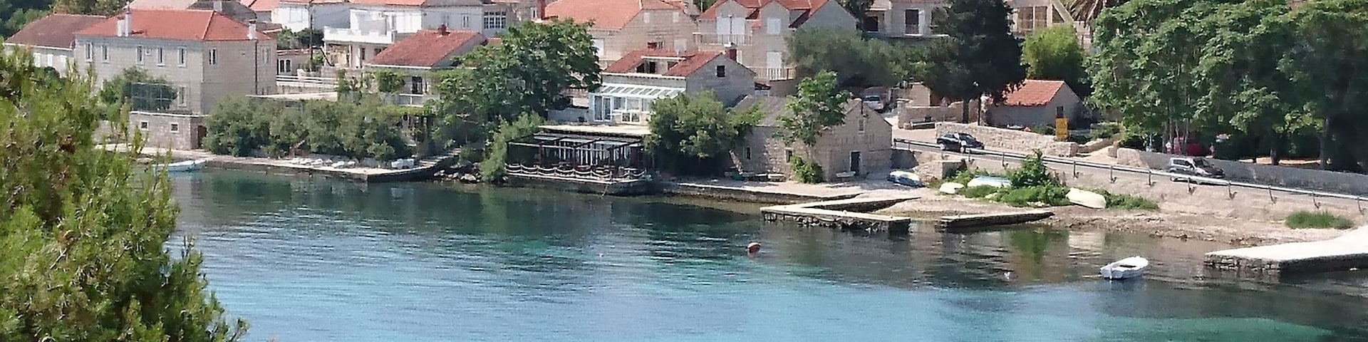 Small town of Lumbarda, view from the balcony with sicardas humming in the background.