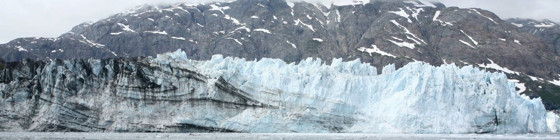 Glacier Bay National Park showing a bay or harbor and mountains