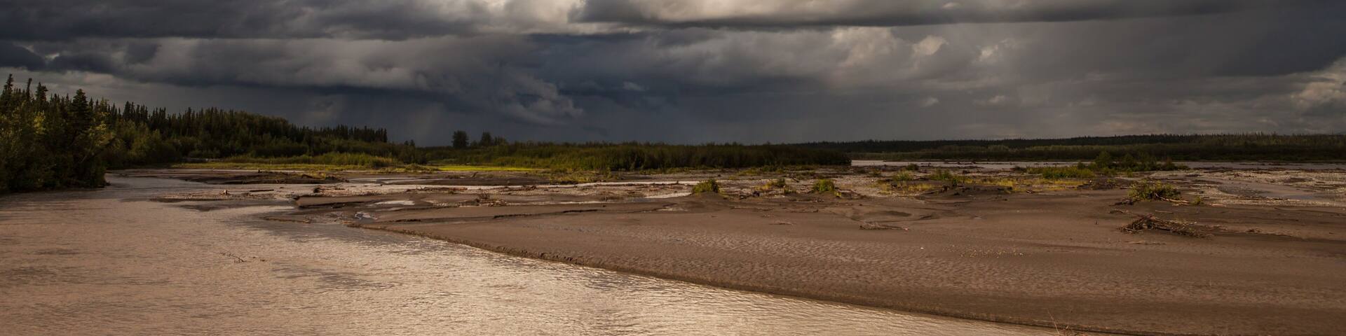Storm clouds over the Copper River in Alaska in summer.
