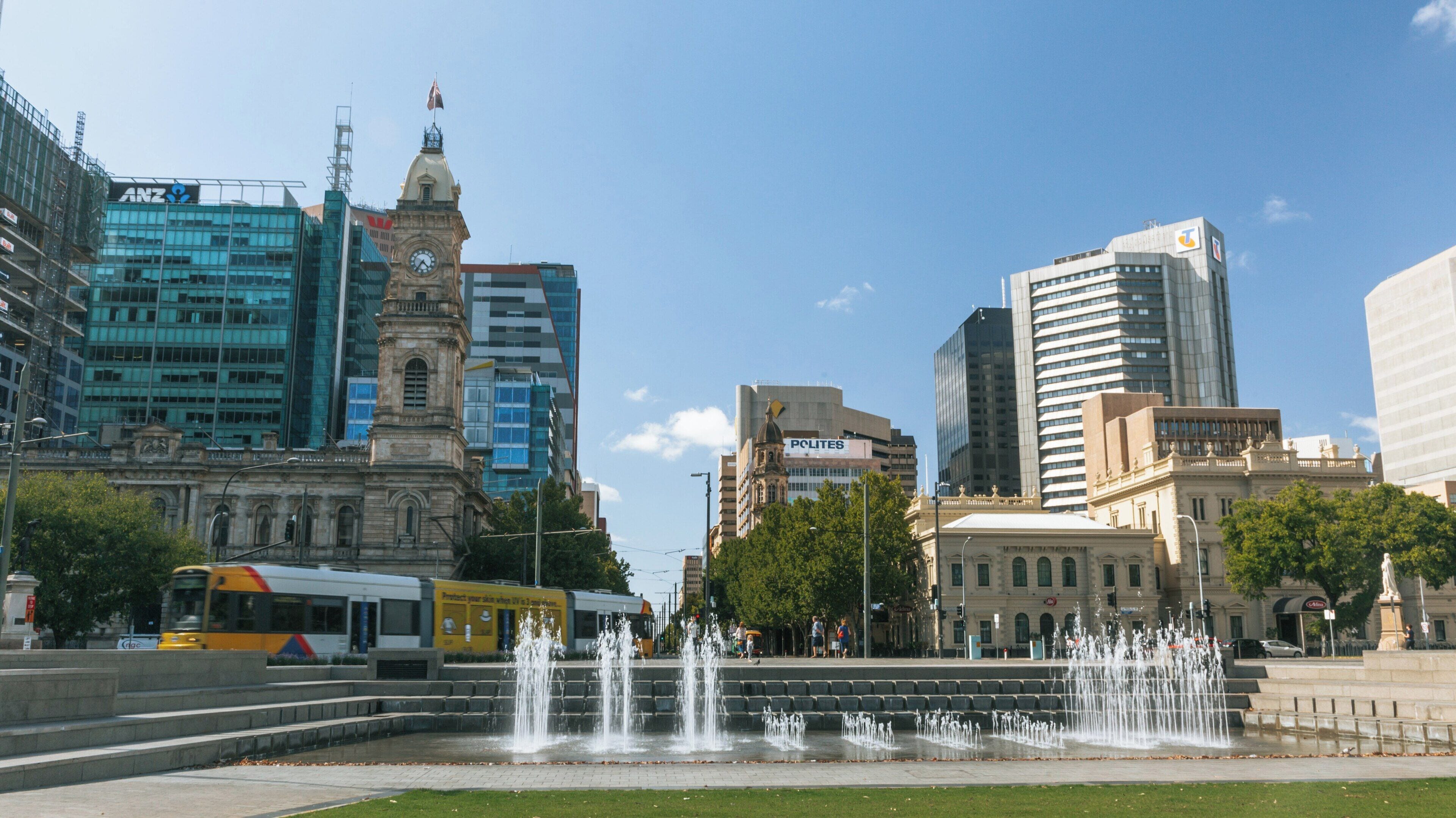 Fountains at Victoria Square in the heart of Adelaide City showcasing modern architecture and vibrant urban life