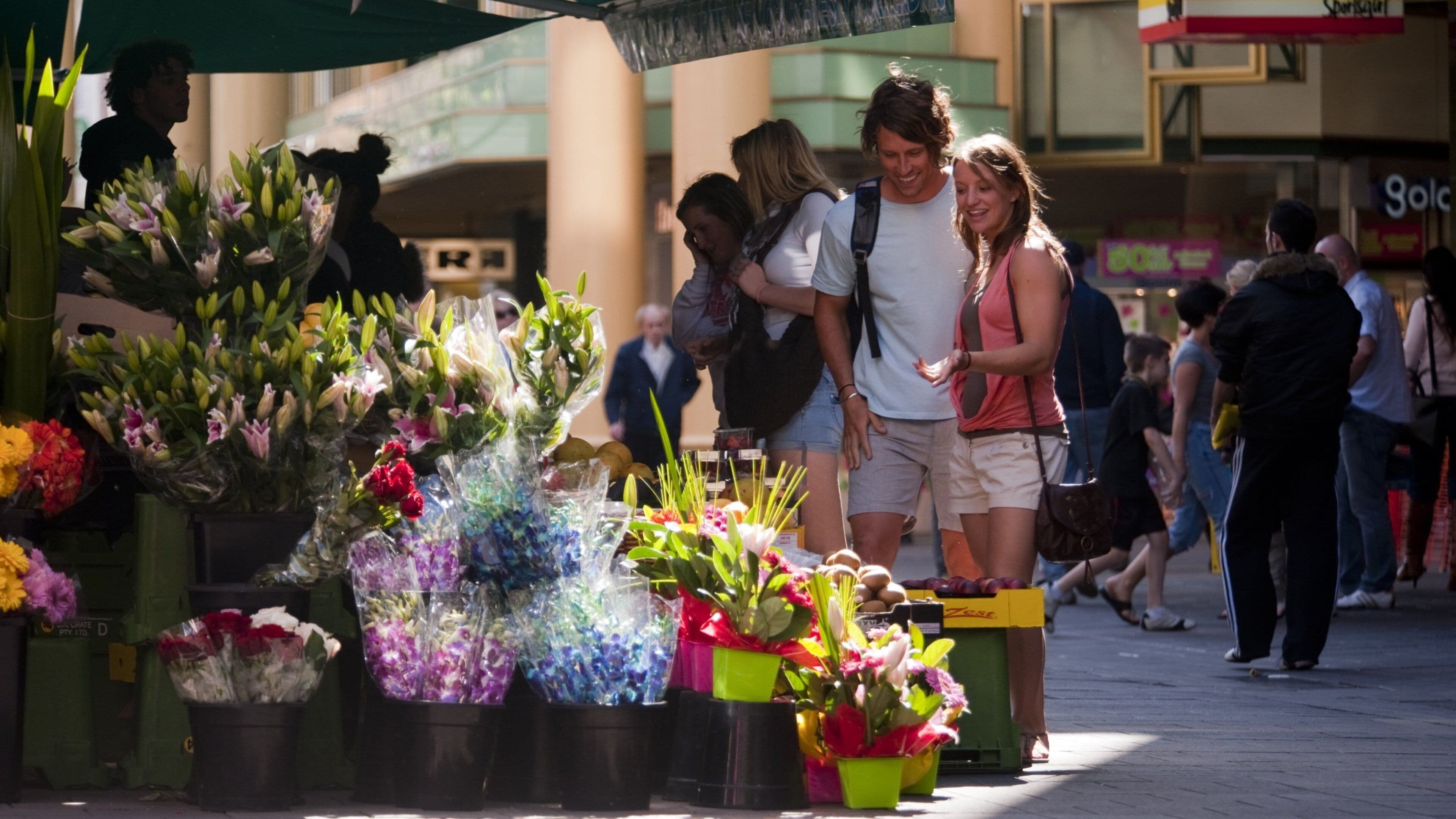 Rundle Mall featuring flowers as well as a couple