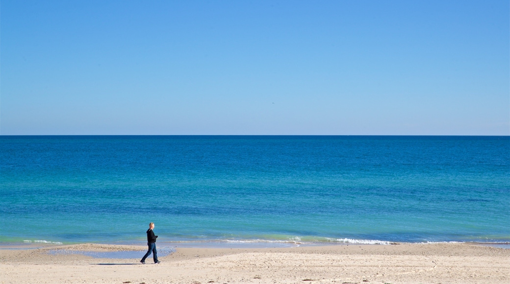 West Beach which includes a sandy beach and general coastal views as well as an individual male