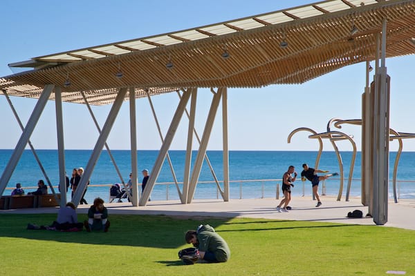 Henley Beach which includes a park and general coastal views as well as a small group of people