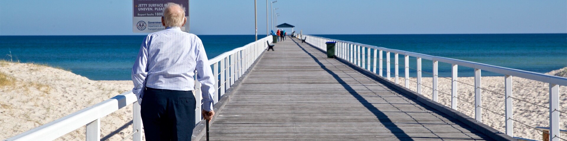 Grange Beach showing a sandy beach, general coastal views and signage