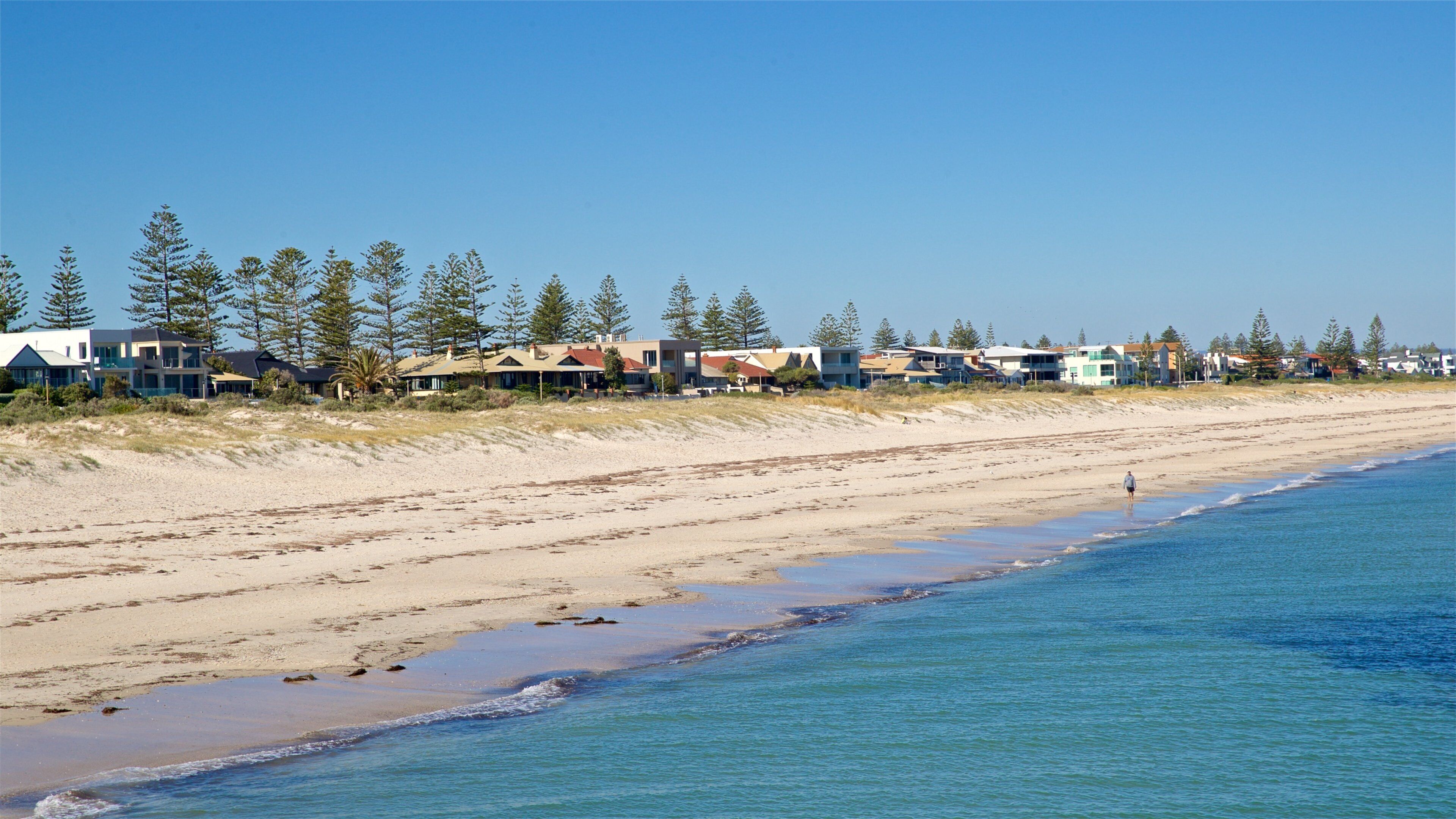 Grange Beach which includes a coastal town, a sandy beach and general coastal views