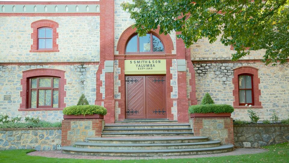 A historic building with a stone facade, red brick accents, and a sign reading "S. Smith & Son Yalumba Established 1849".
