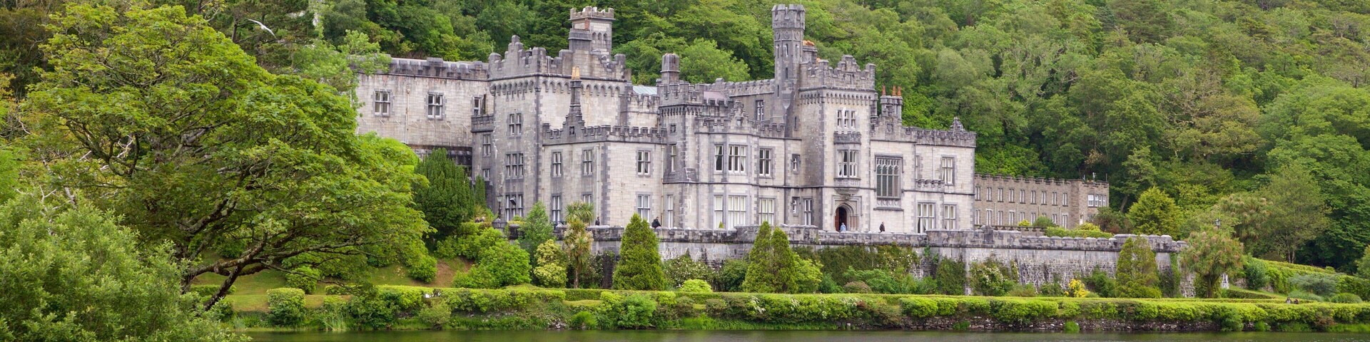 Kylemore Abbey & Garden showing heritage architecture, a river or creek and a castle