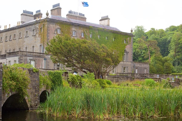 Westport House featuring a bridge, heritage architecture and a river or creek