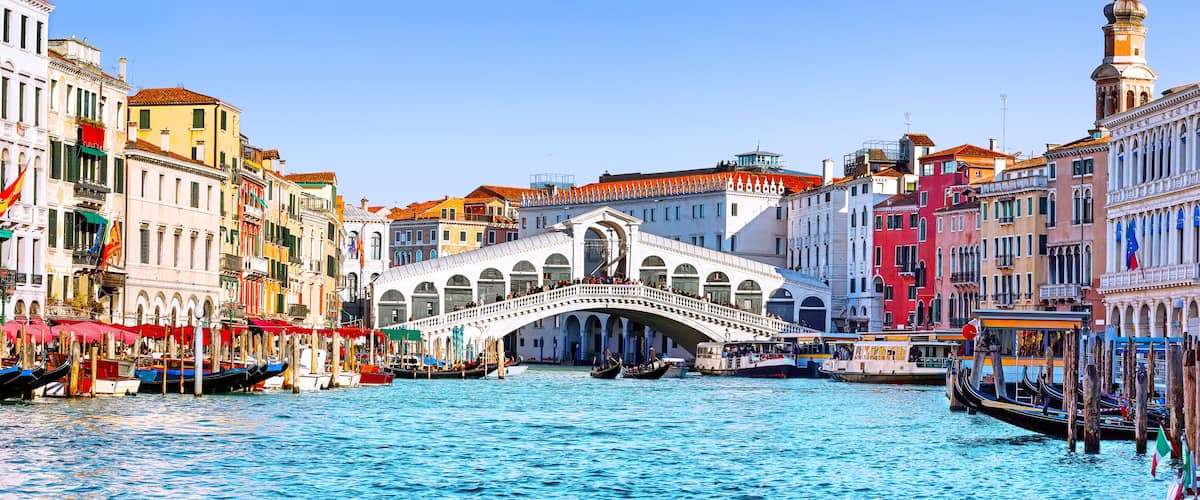 The Grand Canal in Venice with the Bridge of Sighs and colorful buildings.
