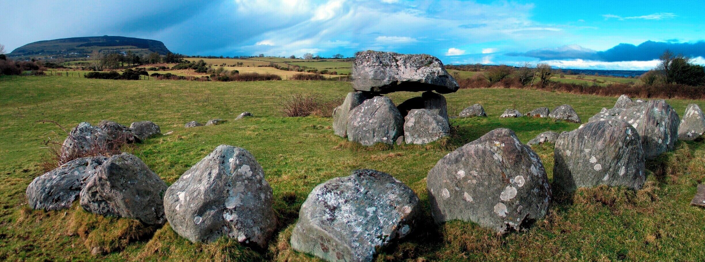 Site 7 at Carrowmore in County Sligo, once  known locally as The Kissing Stone, with a view of Knocknarea mountain.
