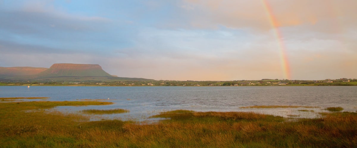 Ben Bulben featuring mountains, tranquil scenes and a river or creek