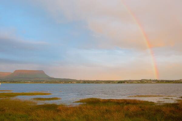 Ben Bulben featuring mountains, tranquil scenes and a river or creek