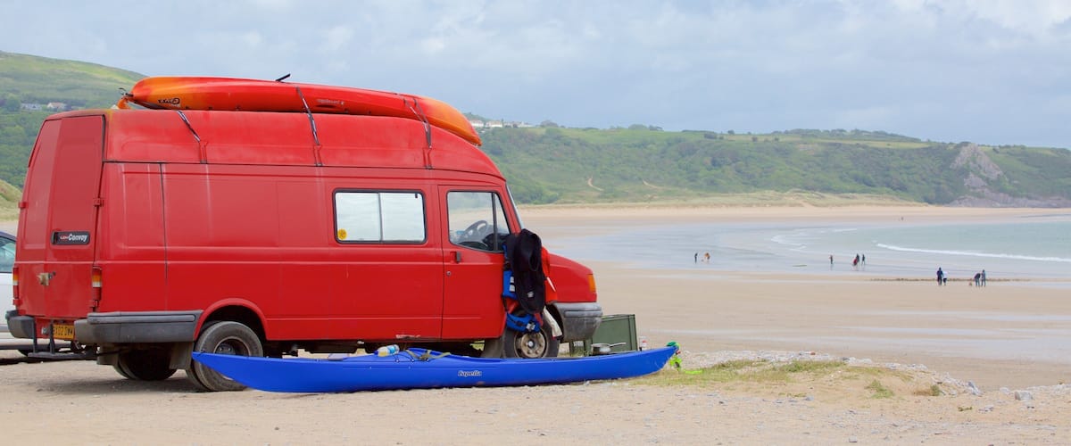 Oxwich Bay Beach featuring a beach and vehicle touring