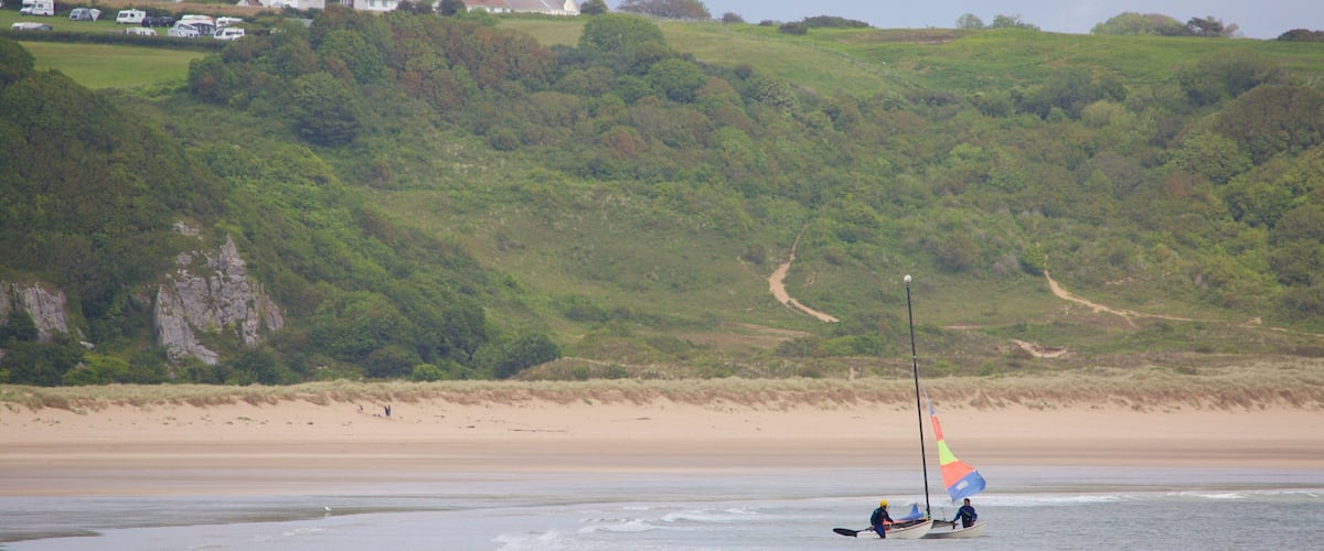 Oxwich Bay Beach which includes a bay or harbour and a beach