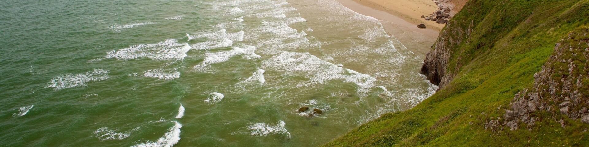 Rhossili Beach showing a beach and landscape views