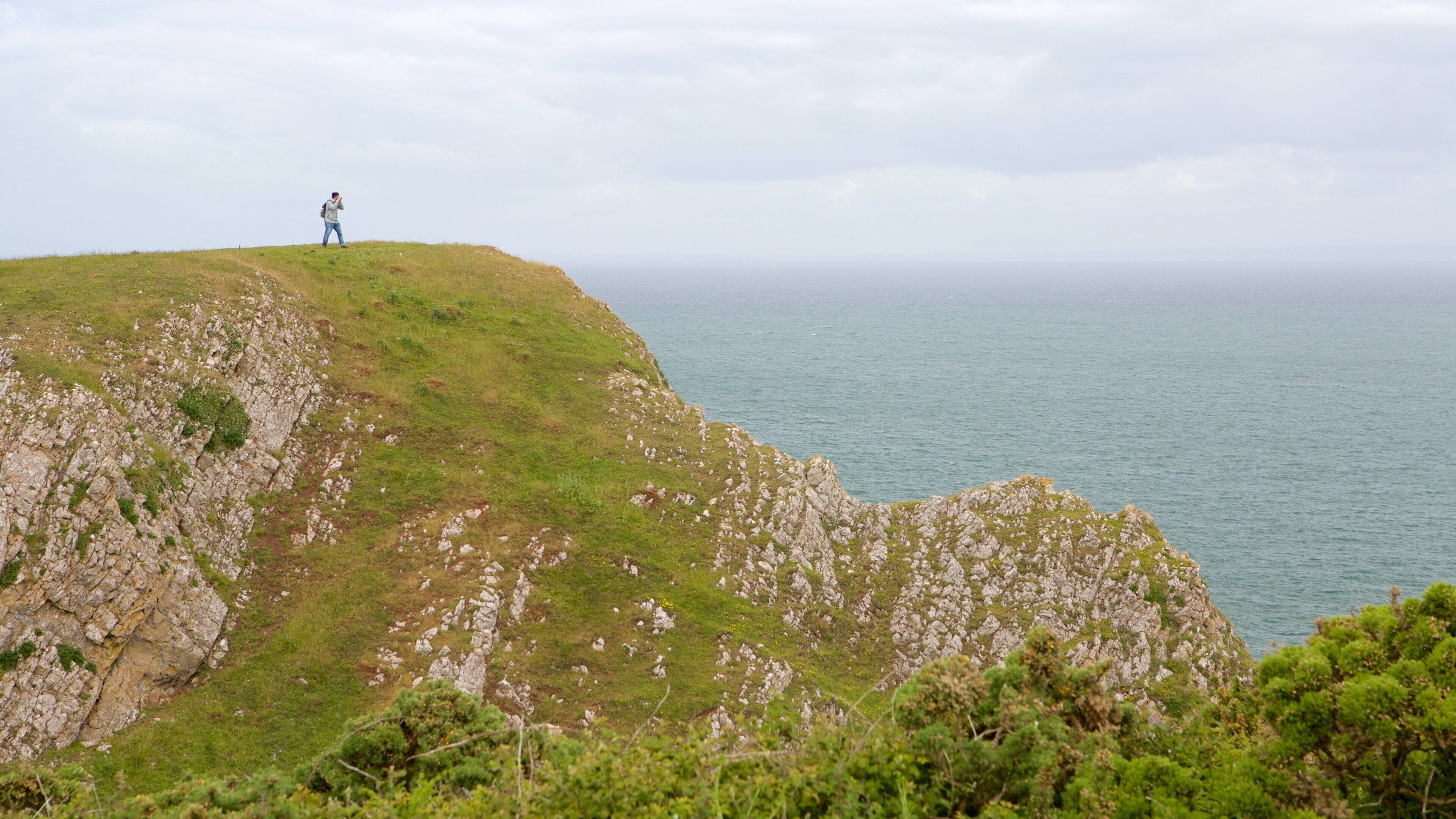 Rhossili Beach featuring general coastal views and mountains