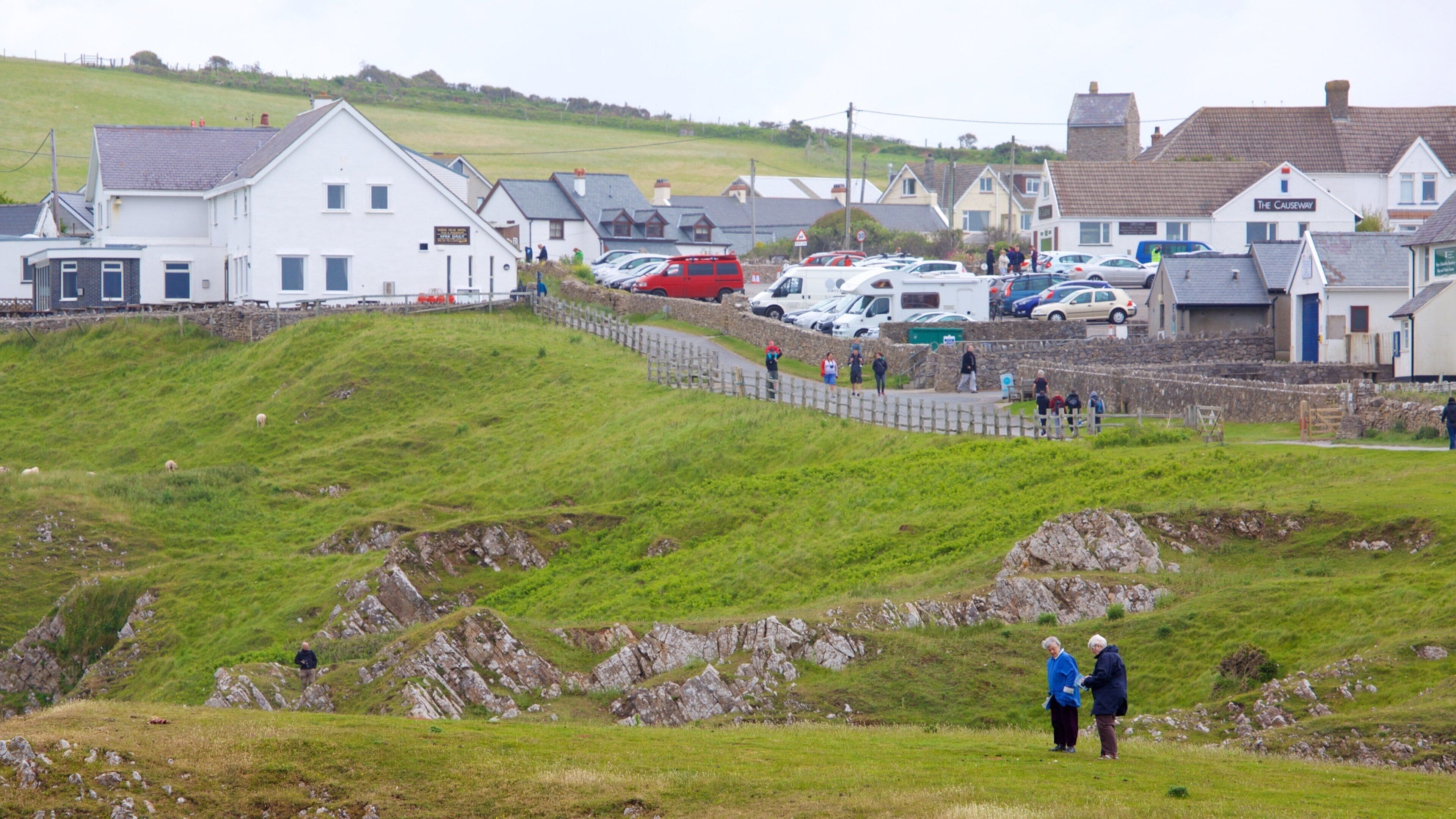 Rhossili Beach showing a small town or village