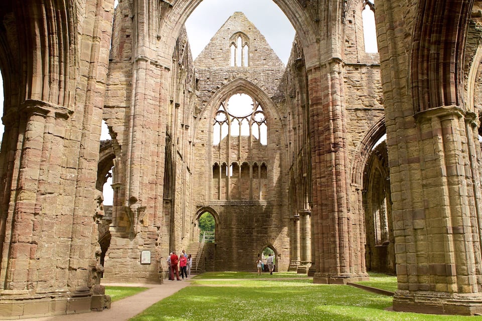A historic stone cathedral with large arches and Gothic windows.